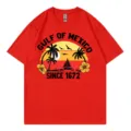 T-shirt rouge à manches courtes et col rond avec impression graphique coucher de soleil. - S / Hauts / Rouge