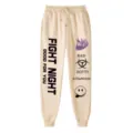 Pantaloni della tuta beige casual con stampa grafica, cordoncino in vita e vestibilità ampia. - Taglia S / Pantaloni e gonne / Kaki