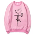 Pink long sleeve crewneck sweatshirt for women featuring faith heart graphic print casual top view - S / Tops / Pink