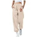 Pantaloni della tuta felpati beige con stampa scimmia, coulisse in vita e tasche laterali. - Taglia S / Pantaloni e gonne / Kaki