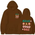 Sweat à capuche marron décontracté avec texte positif rétro et motifs floraux imprimés. - Café