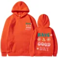 Sweat à capuche orange avec texte et jolies fleurs, pull décontracté pour tous. - Orange