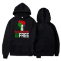 Black hooded sweatshirt with Palestine freedom fist graphic print, casual streetwear style. - S / Tops / Black