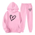 Pink tracksuit set featuring a hooded sweatshirt and sweatpants with a cute heart graphic. - S / Top And Bottom / Pink