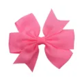 Close-up of a bright pink grosgrain ribbon hair bow showing the textured ribbed pattern - Peach