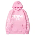 Détail de sweat à capuche rose avec impression sur la poitrine et typographie japonaise. - S / Hauts / Rose