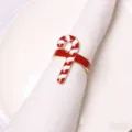 Christmas candy cane napkin ring detail view, festive red and white table decor for holiday parties. - Candy Cane Napkin Ring