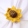Close up detail of fabric sunflower napkin ring, perfect for creative table decor setting. - Sunflower Yellow