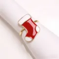 Detailed close-up shot of the Christmas stocking napkin ring with vibrant red and white enamel. - Boot Napkin Ring