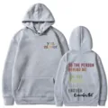 Felpa con cappuccio grigia con stampa di testo stimolante sul petto, comodo abbigliamento casual. - Taglia S / Top / Grigio chiaro