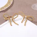 Gold woven bow napkin ring detail, exquisite pearl center accent for table decor. - Khaki