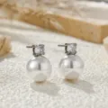Detailed shot of elegant pearl and zirconia stud earrings with a refined minimalist design. - Freshwater Pearl Earrings (C458) / Silver