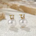 Elegant gold-plated stud earrings featuring a sparkling cubic zirconia and a white pearl. - Freshwater Pearl Earrings (C458) / Gold