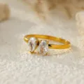 Elegant gold plated stainless steel ring featuring pear and oval cubic zirconia stones. - Size 6 / Oval and Water Drop Style (C472) / Gold