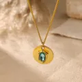 Close up of gold plated necklace with blue zircon pendant irregular metal charm detail - Irregular Round Tag Necklace (C419) / Blue Zirconia Gold