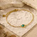 Gold plated chain bracelet featuring an irregular green zircon stone in a chic design. - Irregular Shape Bracelet (C419) / Green Zirconia Gold