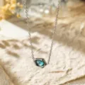 Silver tone chain necklace featuring an irregular geometric blue zircon pendant for daily wear. - Irregular Shape Necklace (C419) / Silver with Blue Zirconia
