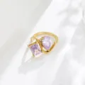 Detail shot of 18K gold plated purple cubic zirconia twin ring, elegant geometric hollow design. - Size 6 / Light Purple Stone Style Gold