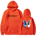 Orange fleece hoodie featuring front quote butterfly text and large back graphic print. - S / Tops / Orange