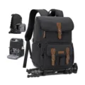 Details view of canvas camera backpack showing interior compartment and bottom tripod strap. - 30L / Black