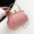 Elegant pink tweed handbag with gold-tone circular handle and detachable chain strap - Pink