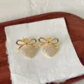 Exquisitos pendientes colgantes de corazón y lazo de circonita cúbica de oro de 18k. - Estilo Corazón con Lazo Dorado (G2) / Dorado