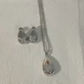 Silver teardrop necklace and earrings set with micro-pave zircon butterfly design for women. - Butterfly