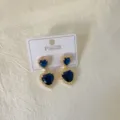 Close-up of double-layer heart blue gemstone earrings with rhinestones on white card. - Heart Blue