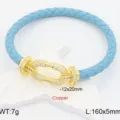Bracciale in pelle intrecciata blu con chiusura a ferro di cavallo dorata con zirconi. - Aqua