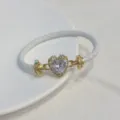 Bracciale in pelle intrecciata bianca placcato oro con charm cuore in zircone elegante. - Bianco