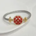Elegant 18k gold plated cable wire bracelet with micro paved red and white zircon center stone. - Red