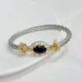 Luxury two-tone cable wire bracelet with oval dark stone and sparkling zircon halo design. - Silver Black