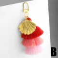 Chic shell tassel keychain bag charm with gradient pink cotton fringe and gold lobster clasp. - Shell Style / Pink Gradient