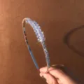 Detailed shot of sparkling marquise-cut rhinestone hairband, elegant crystal side hair accessory. - Wheat Ear Style
