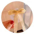 Elegante gelbe Haarklammer mit einer Schleife aus transparentem Band für Mädchenfrisuren - Quaste Haarklammer / Gelb