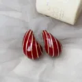 Luxury red enamel teardrop earrings with elegant gold vertical lines, stylish geometric jewelry. - Burgundy