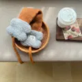 Detailed view of the Korean style autumn winter plush strap earmuffs, soft knit warm ear covers. - One Size / Pumpkin Orange