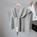 Grey wool blend knit shawl detail view, versatile layered knotted capelet for women. - Light Gray Striped Shawl with Wool