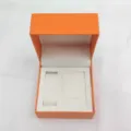 Luxury orange watch box and jewelry gift storage box with white interior slots for watches and necklaces. - Orange