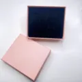 Pink jewelry gift box detail view with black velvet insert for watches and necklaces. - Lid And Base Box / Pink