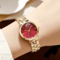 Elegante Damen-Quarzuhr mit auffälligem rotem Zifferblatt, goldenem Armband und Gehäuse. - Gold und Rot