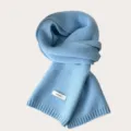 Light blue pure wool knitted scarf, soft texture, cozy winter accessory for women detail view. - Iceland Blue