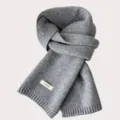 Grey knit wool scarf detail view, showing soft texture, cozy winter accessory design. - Pencil Gray