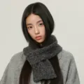 Cozy dark grey knitted winter scarf paired with an elegant grey coat for daily warmth. - Dark Gray Scarf