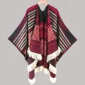 Detailed view of the ethnic style knitted cape with geometric patterns and fringe hem. - Split Scarf Wine Red