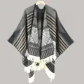 Details of the ethnic style knitted poncho shawl with fringe and geometric patterns in gray. - Split Scarf Black & Grey