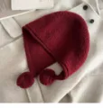 Burgundy knitted balaclava hat with dual pom-poms, warm winter wool ear-flap cap. - M (56-58cm) / Ancorra Red