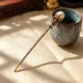 Vintage Chinese style bronze hair stick with pearl and rhinestone decor for women. - Vintage Pearl Lotus Hair Stick / Champagne
