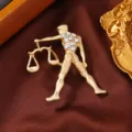 Gold-plated Libra zodiac brooch featuring sparkling rhinestones, elegant clothing accessory. - Libra