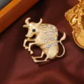 Matte gold zodiac ox brooch featuring sparkling rhinestones and elegant animal design for women. - Taurus